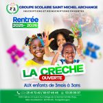 cute pupils running and smiling at camera in hallway at the elementary school