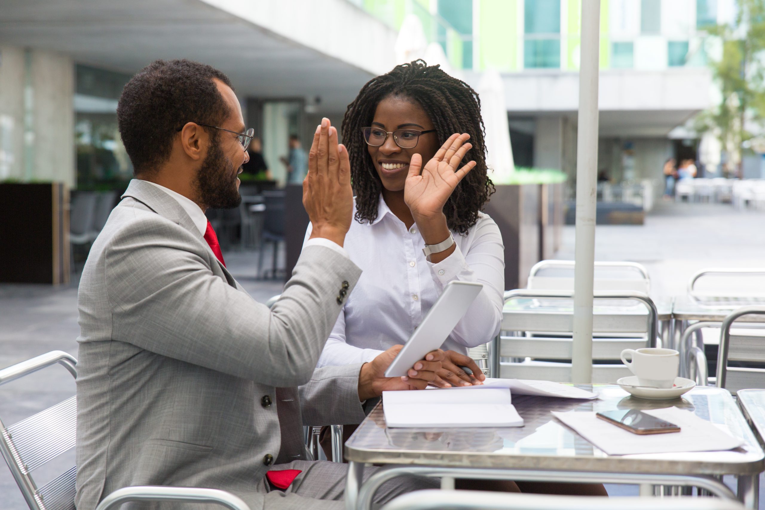 happy business colleagues rejoicing at team success