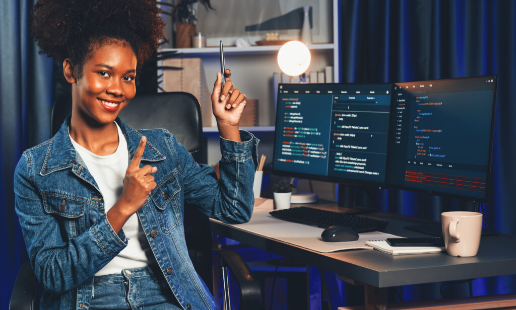 young african it developer presenting program and focus on camera. tastemaker.